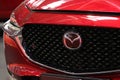 RomaniaÃ¢â¬â2022:Front-side view with logo and detail of a new red car Mazda CX 30.